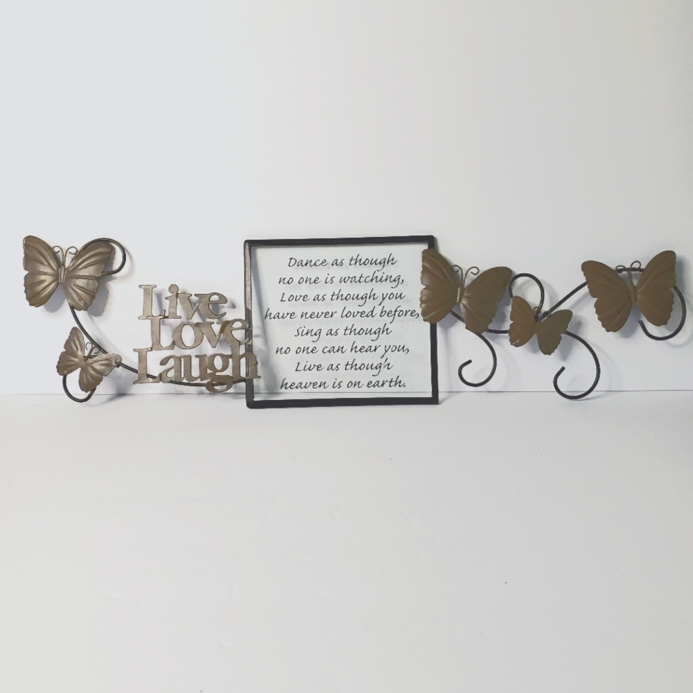 Metal butterfly sign with Mark Twain saying.   107